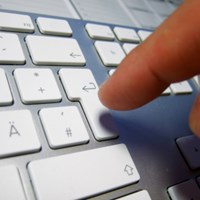 person typing on computer keyboard