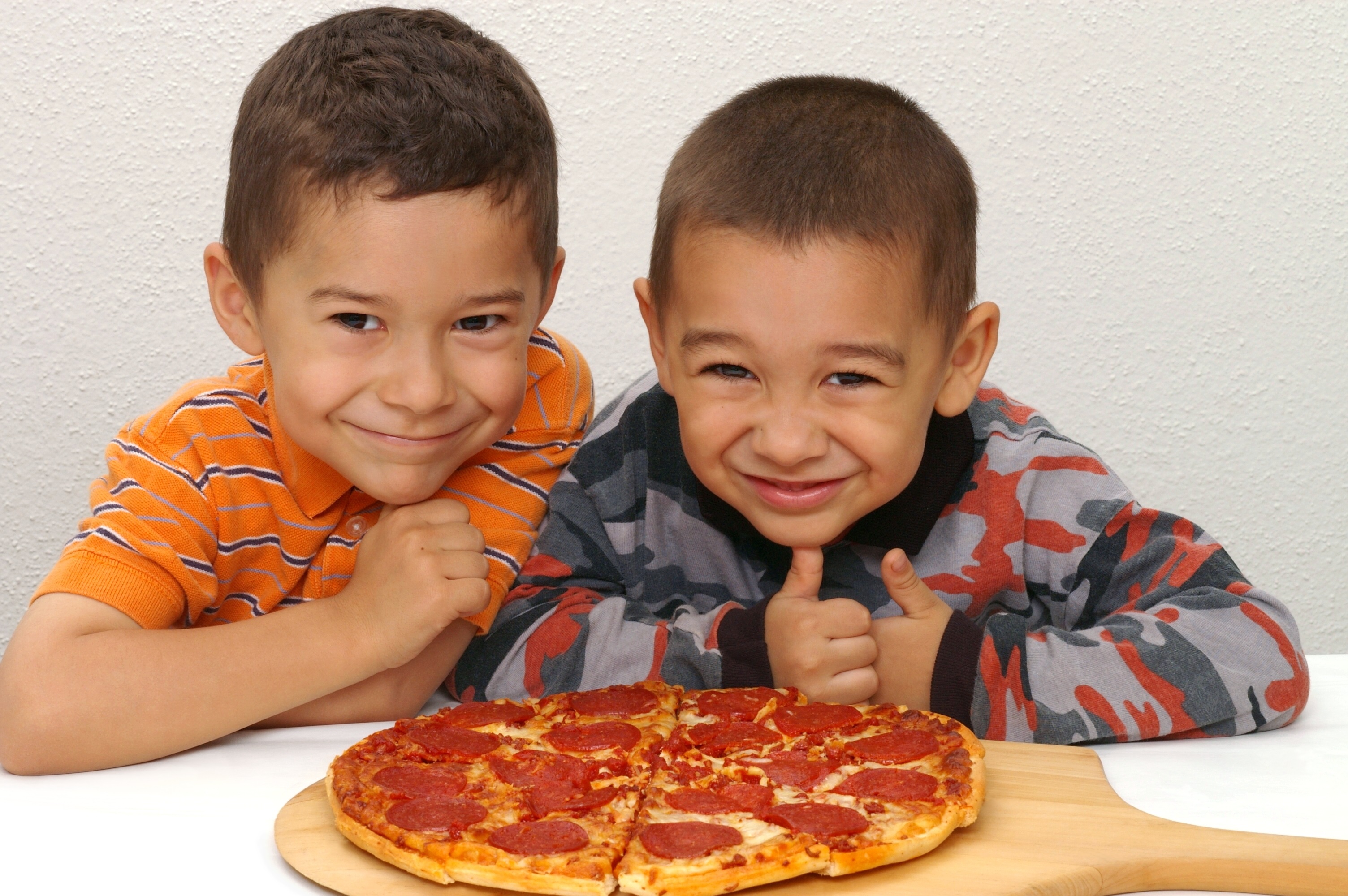 Children enjoying pizza