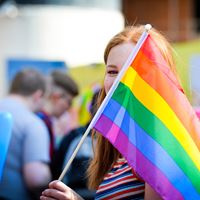 Young girl holding LGBT flag (BW)