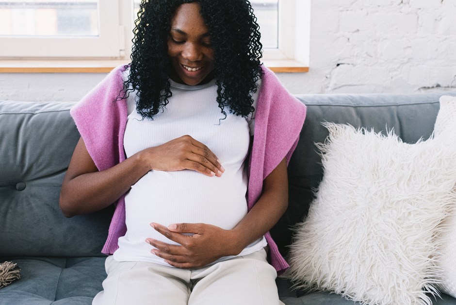 Pregnant woman caressing her bump