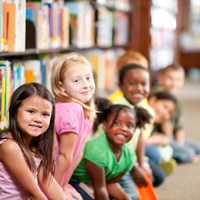 children sitting in a library