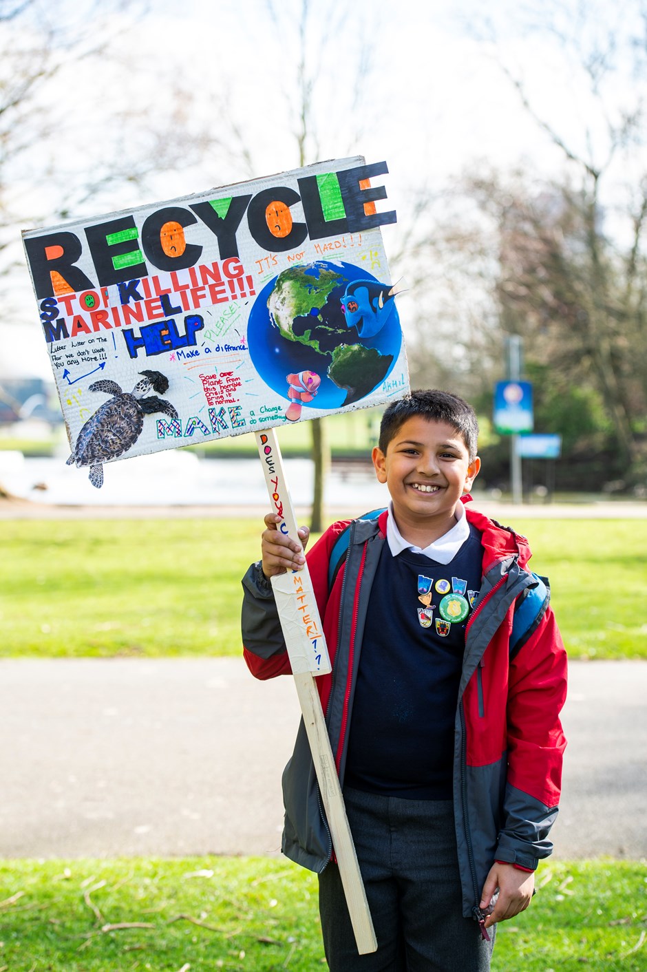 Leicester school child with recycle banner