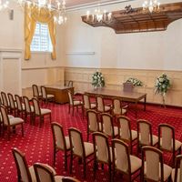 Large ceremony room with chandeliers