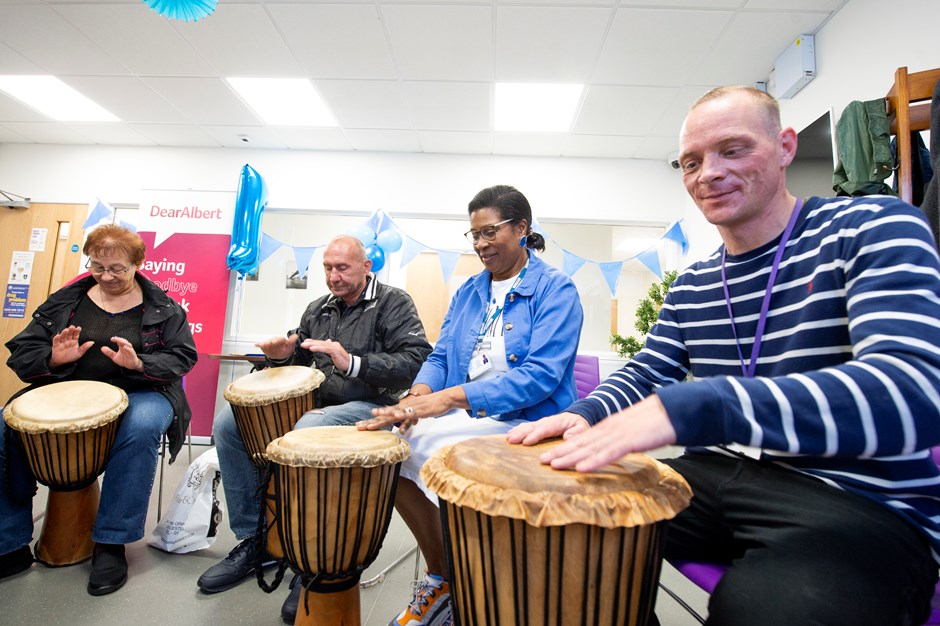 Group of people playing African drums