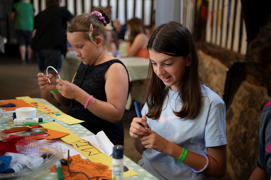 Pre-teens enjoying doing crafts