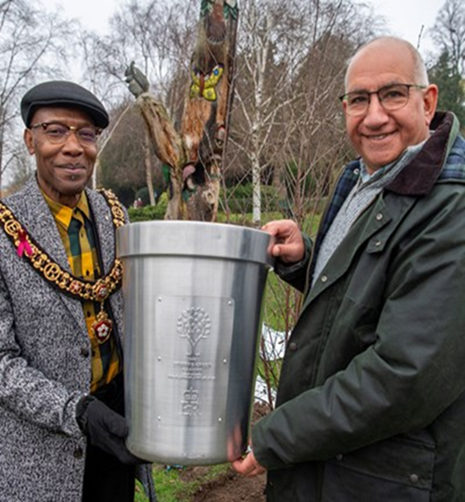 Lord-Lieutenant of Leicester, Mike Kapur OBE (right) presenting the late Queen's Tree of Trees silver pot to Lord Mayor of Leicester, Cllr George Cole (left)
